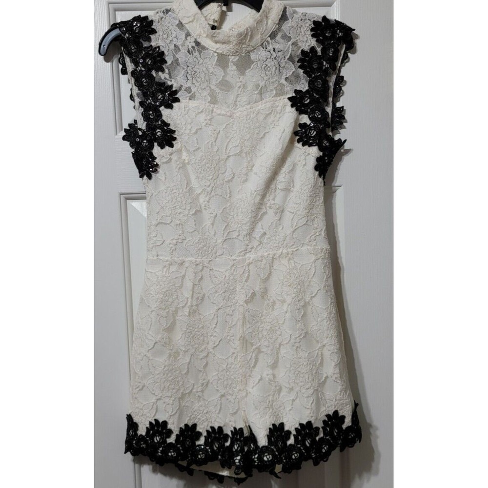 Elegant Lace Jumpsuit with Black Floral Accents